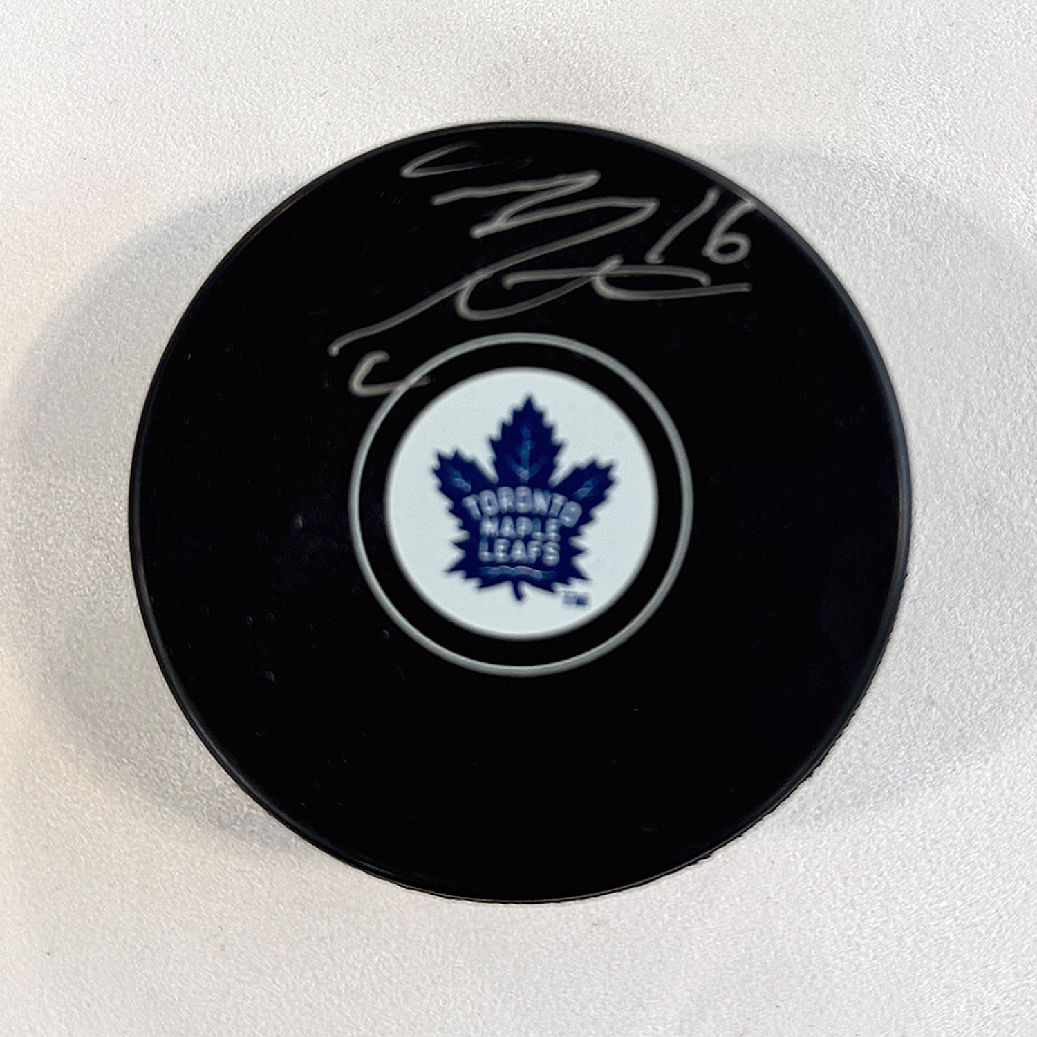 Mitch Marner Autographed Toronto Maple Leafs Hockey Puck (Flawed)