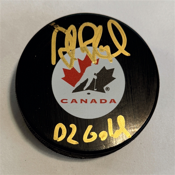 Rob Blake Autographed Team Canada Hockey Puck with 02 Gold Note (Flawed)