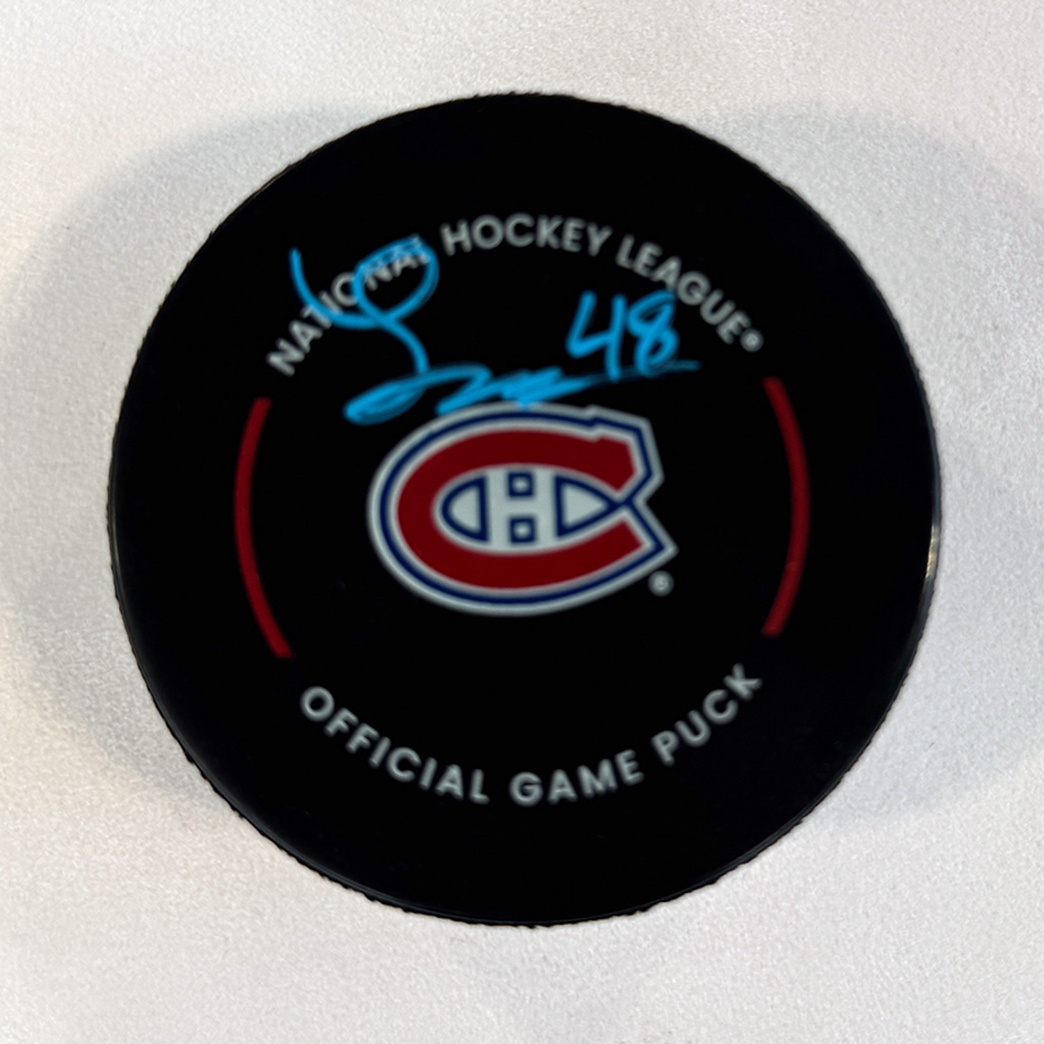 Lane Hutson Autographed Montreal Canadiens Official Game Puck (Flawed)