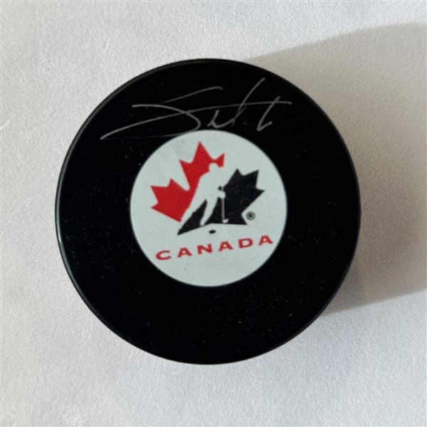 Shea Theodore Autographed Team Canada Hockey Puck (Flawed)