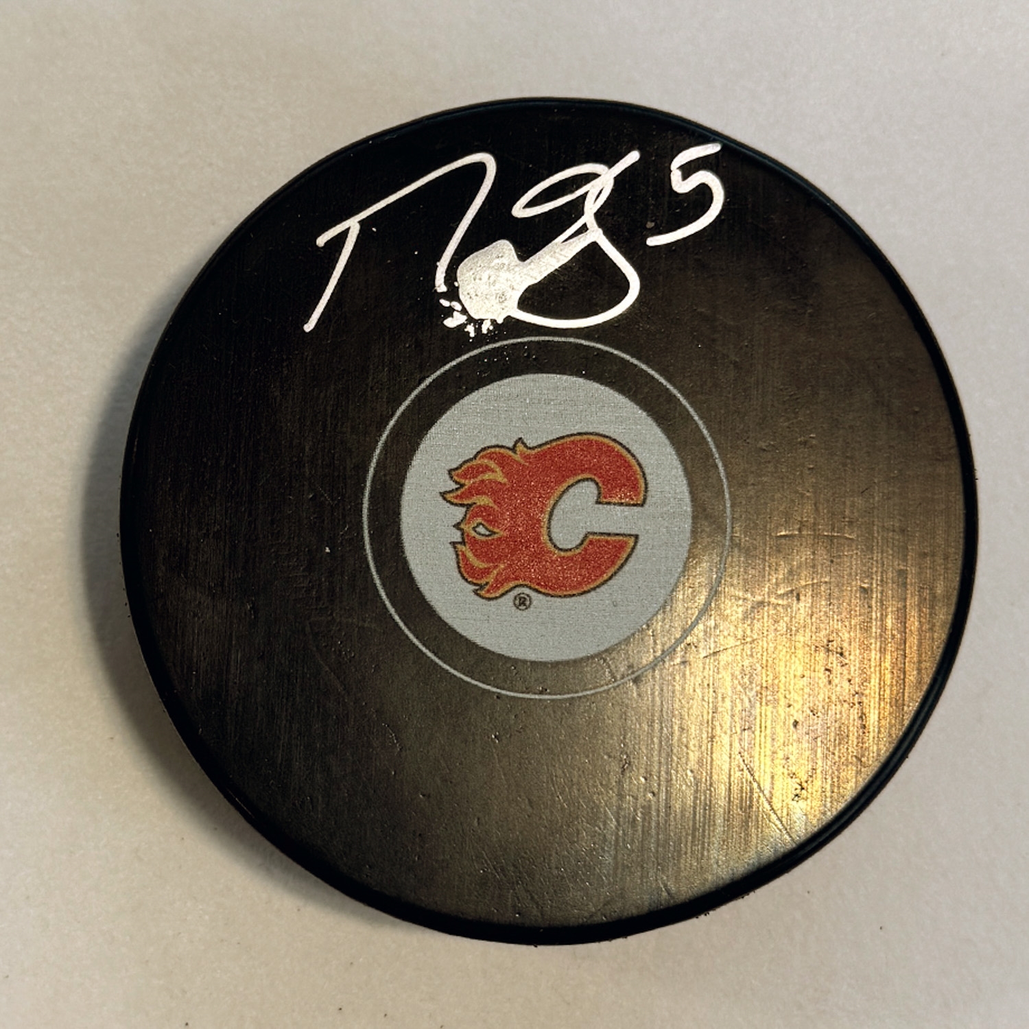 Mark Giordano Autographed Calgary Flames Hockey Puck (Flawed)