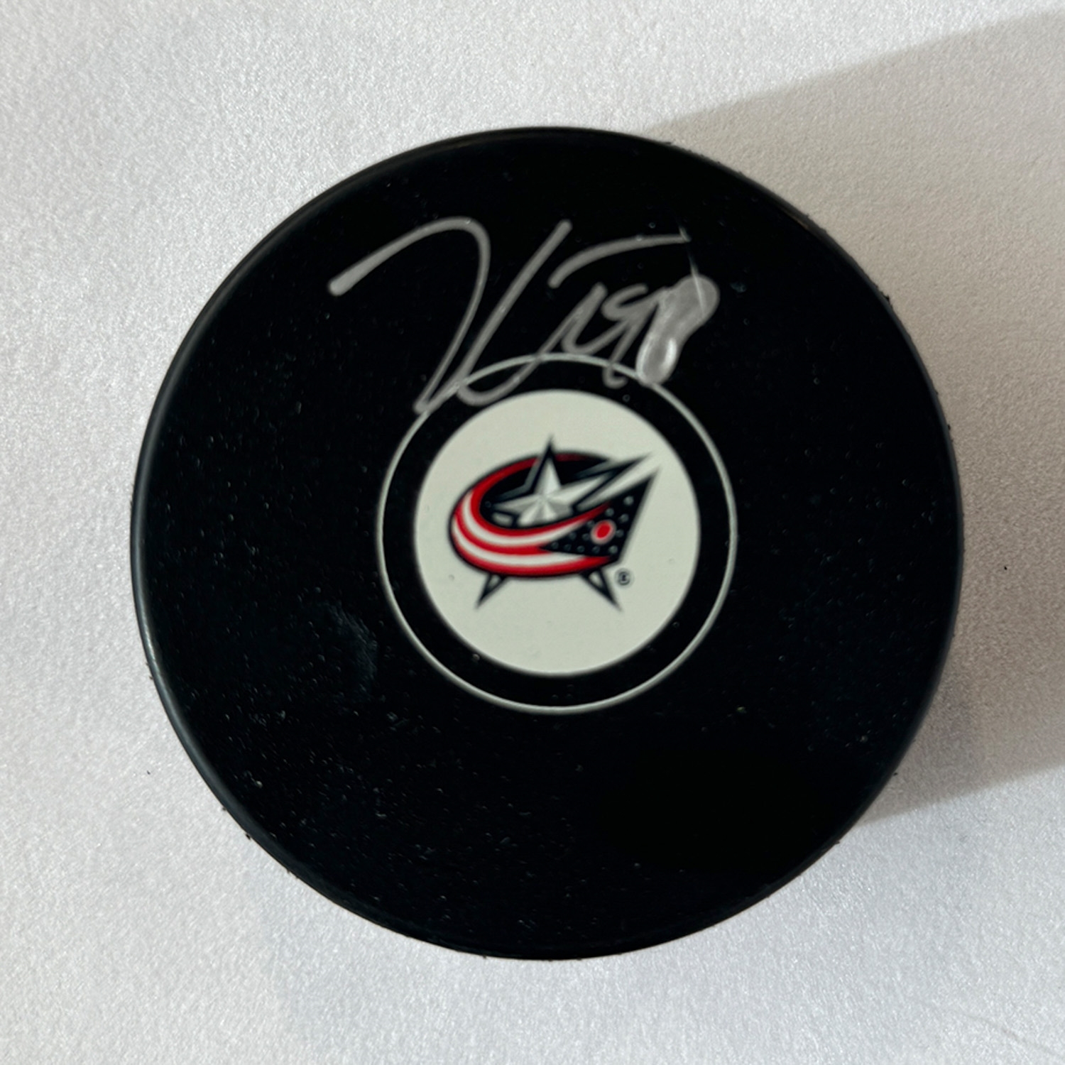 Kent Johnson Autographed Columbus Blue Jackets Hockey Puck (Flawed)