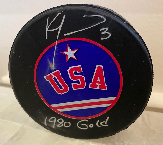 Ken Morrow Team USA Autographed Hockey Puck with 1980 Gold Note (Flawed)