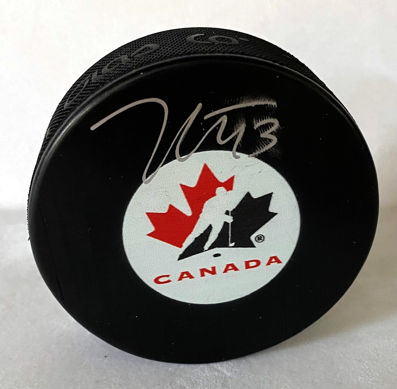 Kent Johnson Signed Team Canada Hockey Puck (Flawed)