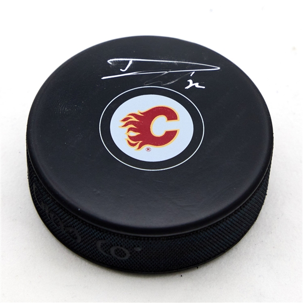 Dustin Wolf Autographed Calgary Flames Hockey Puck (Flawed)