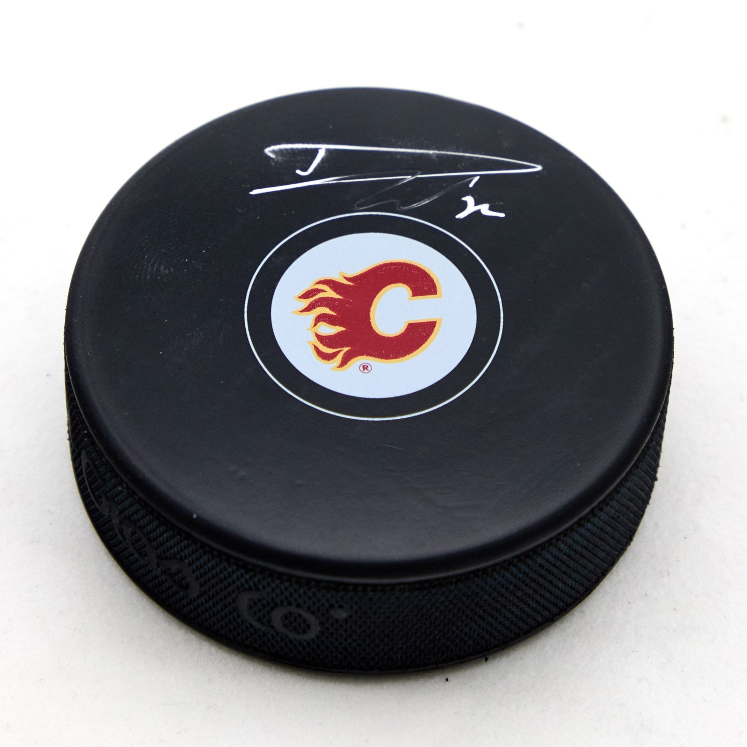 Dustin Wolf Autographed Calgary Flames Hockey Puck (Flawed)