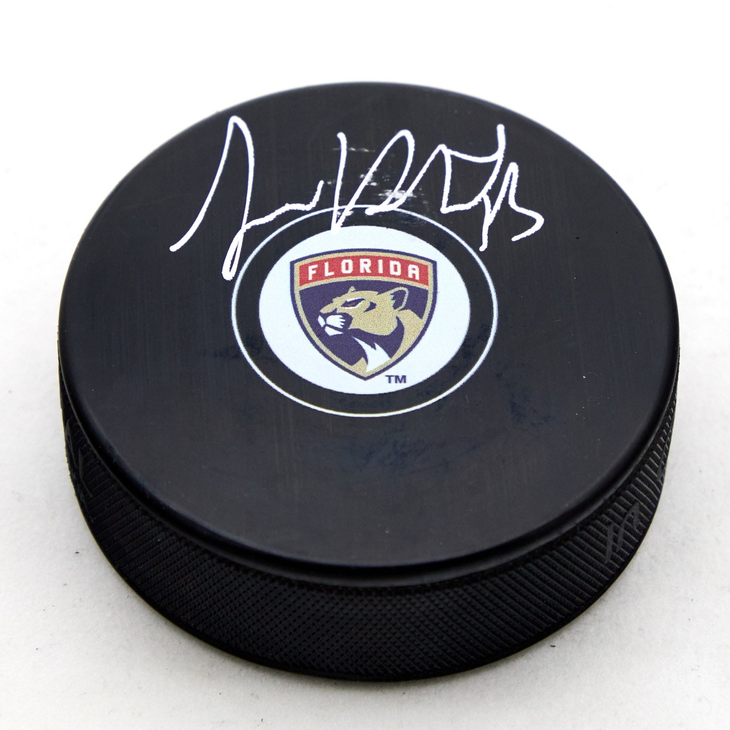 Sam Reinhart Autographed Florida Panthers Hockey Puck (Flawed)