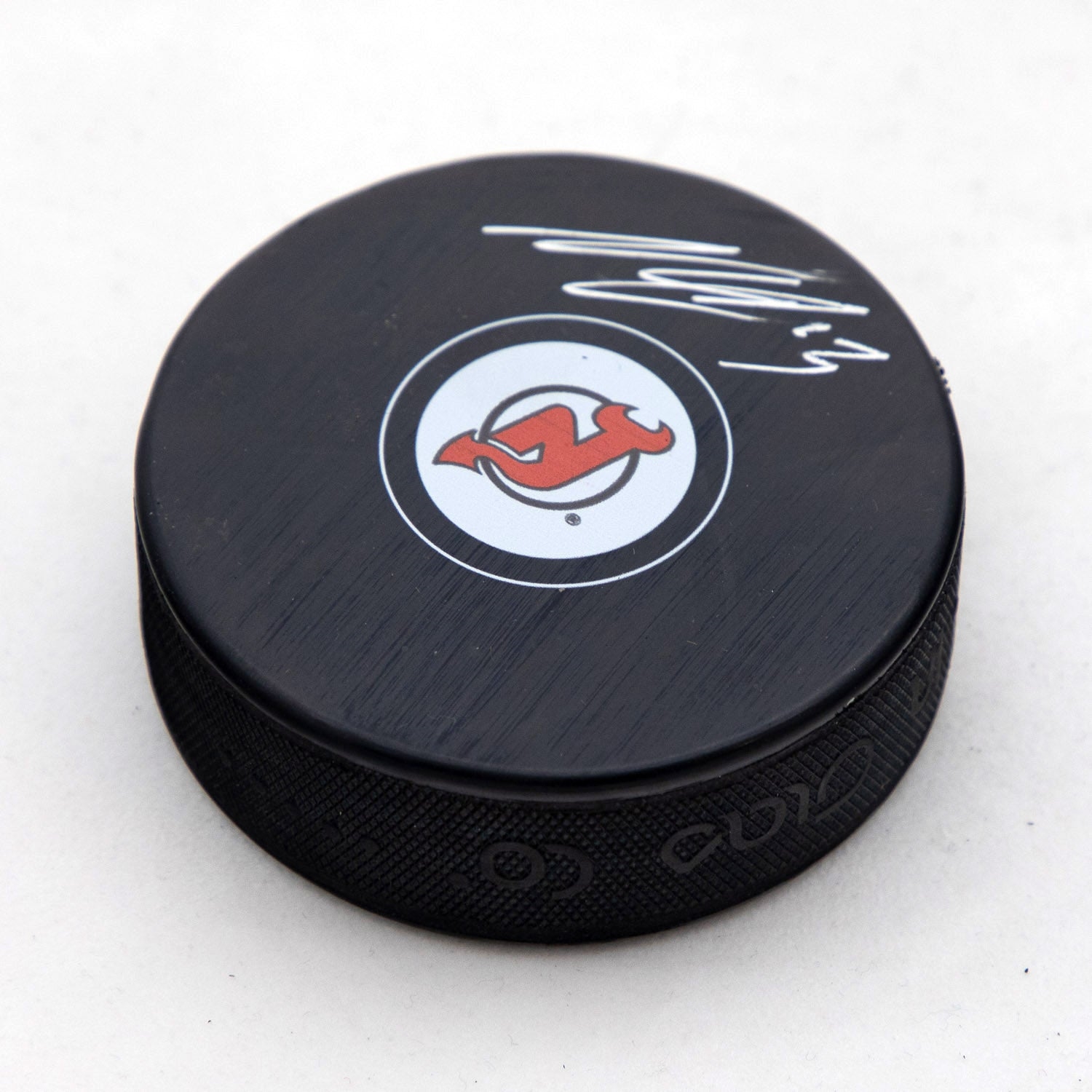 Nico Hischier Autographed New Jersey Devils Hockey Puck (Flawed)