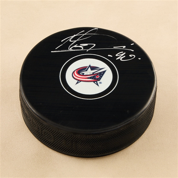 Elvis Merzlikins Autographed Columbus Blue Jackets Hockey Puck (Flawed)