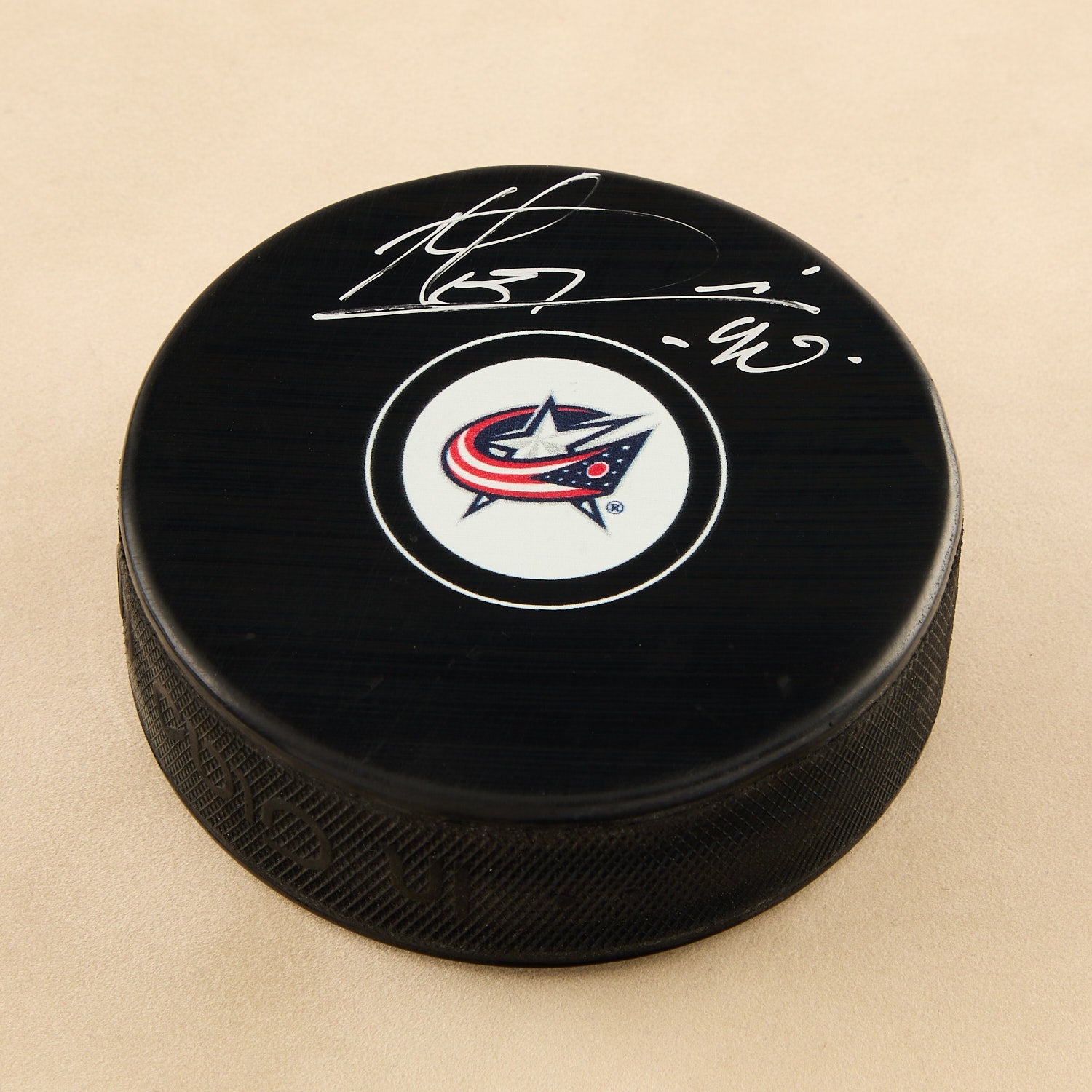 Elvis Merzlikins Autographed Columbus Blue Jackets Hockey Puck (Flawed)